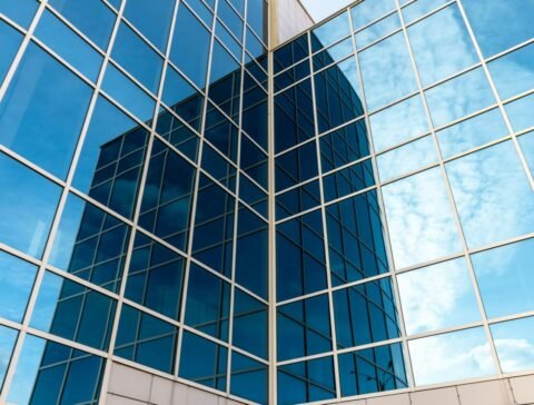glass-building-with-mirrored-windows-skyscraper-line-pattern-perspective-steel-structure-urban.jpg